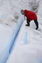 Tourist looking into a crevasse - Argentina