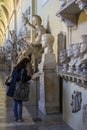 Tourist looking at exhibition at Vatican Museum in Italy