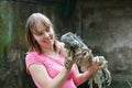 Tourist looking at iguana Royalty Free Stock Photo