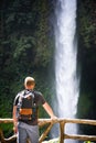 Tourist looking at the La Fortuna Waterfall in Costa Rica Royalty Free Stock Photo