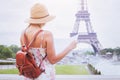Tourist looking at the map of city Paris near Eiffel tower Royalty Free Stock Photo