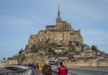 Tourist looking at Mont Saint Michel Normandy France.