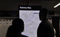 Tourist Looking at NYC Subway Map on Train Platform MTA Station Royalty Free Stock Photo