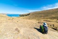 Tourist looking at view from above, Titicaca Lake, Bolivia Royalty Free Stock Photo