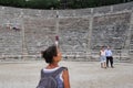 A tourist looks astonished at the archaeological site of Epidaurus