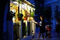 A tourist looks at the menu of a restaurant in Lefkes, Paros island Royalty Free Stock Photo