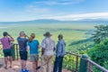 Tourist looks into the Ngorongoro crater National Park with the Lake Magadi from the look out
