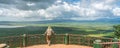 Tourist looks into the Ngorongoro crater National Park with the Lake Magadi from the look out