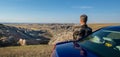 A tourist looks at the scenery off Badlands Loop Road Royalty Free Stock Photo