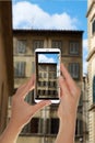 Tourist makes a photo of the facade of old building Royalty Free Stock Photo