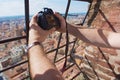 Tourist makes a travel photo from the top of Asinelli tower in Bologna, Italy.