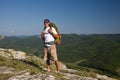 Tourist male looking on the sun and smilling