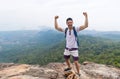 Tourist Man With Backpack Standing On Mountain Top Raised Hands Happy Smiling Over Beautiful Landscape Royalty Free Stock Photo