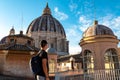 Rome - Tourist man with close up view on the main dome of Saint Peter basilica in Vatican city, Rome, Europe Royalty Free Stock Photo