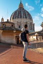 Rome - Tourist man with close up view on the main dome of Saint Peter basilica in Vatican city, Rome, Europe Royalty Free Stock Photo