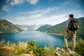 Tourist man enjoying amazing sea view of the Bay of Kotor, Montenegro Royalty Free Stock Photo