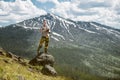 Tourist man photographer taking photos and enjoy the view of mountains in Yellowstone National Park Royalty Free Stock Photo