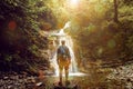 Tourist Man Reached Destination And Enjoys View Of Waterfall, Rear View, Contemplation Adventure Concept Royalty Free Stock Photo