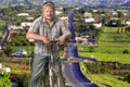 Tourist man standing with a bicycle on the countryside background Royalty Free Stock Photo