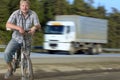 Tourist man standing on the road with a bicycle Royalty Free Stock Photo