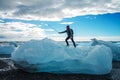 Tourist man taking selfie on small iceberg