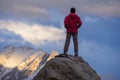 Tourist man on top of the mountain in the Karakoram mountain range view from Hunza viewpoint, Gilgit Baltistan, Northern Pakistan Royalty Free Stock Photo