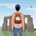 Tourist man visits the archaeological site of Stonehenge