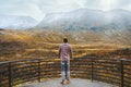 Tourist man walking in Norway travel adventure outdoor mountains view active healthy lifestyle scandinavian nature autumn season