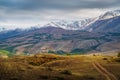 Tourist minibus on a field road on a hillside Royalty Free Stock Photo