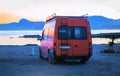 Tourist minibus on the sandy seashore