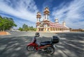 A tourist motorbike in front of the old holy temple in morning