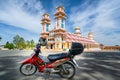 A tourist motorbike in front of the old holy temple in morning
