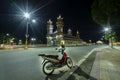 A tourist motorbike in front of the old holy temple in night