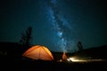 Tourist near his camp tent at night.