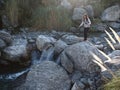 Tourist next to stream in Villa de Merlo Royalty Free Stock Photo