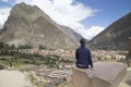 Tourist observing the city with a panoramic view in Ollantaytambo is a town in the Sacred Valley of Peru, which lies south on the