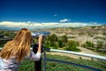 Tourist observing the landscape of the Canadian Badlands