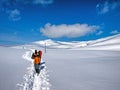 Tourist walking on a snow path