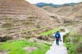 tourist on path between terraced fields in Dazhai Royalty Free Stock Photo