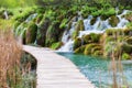 Tourist path and waterfalls in Plitvice Lakes National Park, Croatia Royalty Free Stock Photo