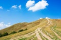 Tourist path winding uphill the mountain ridge Royalty Free Stock Photo