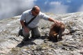 Tourist patting a kangaroo Royalty Free Stock Photo