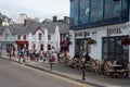 Tourist people sitting in the restaurant and coffee shop at Baltimore town Cork County Ireland