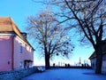 Tourist people on the street in Historical medieval city, view on Old town ,Tallinn panorama ,bench in park , blue sky on spring d Royalty Free Stock Photo