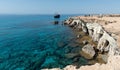 Tourist people swimming and exploring the sea caves. Cape Greco at Protaras Cyprus