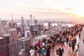 Tourist people taking pictures from rooftop on Manhattan skyscraper