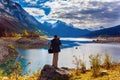 Tourist with a photo bag photographs Royalty Free Stock Photo