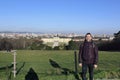 Tourist photographed on the hill in front of SchÃÂ¶nbrunn Palace. Vienna, Austria.