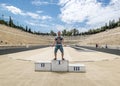 Tourist are photographed on the podium at the Panathenaic stadium Royalty Free Stock Photo