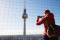 Tourist photographing the TV Tower, Fernsehturm in Berlin